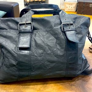 Duffel bag. Black faux leather. Cool buckles. Brand new